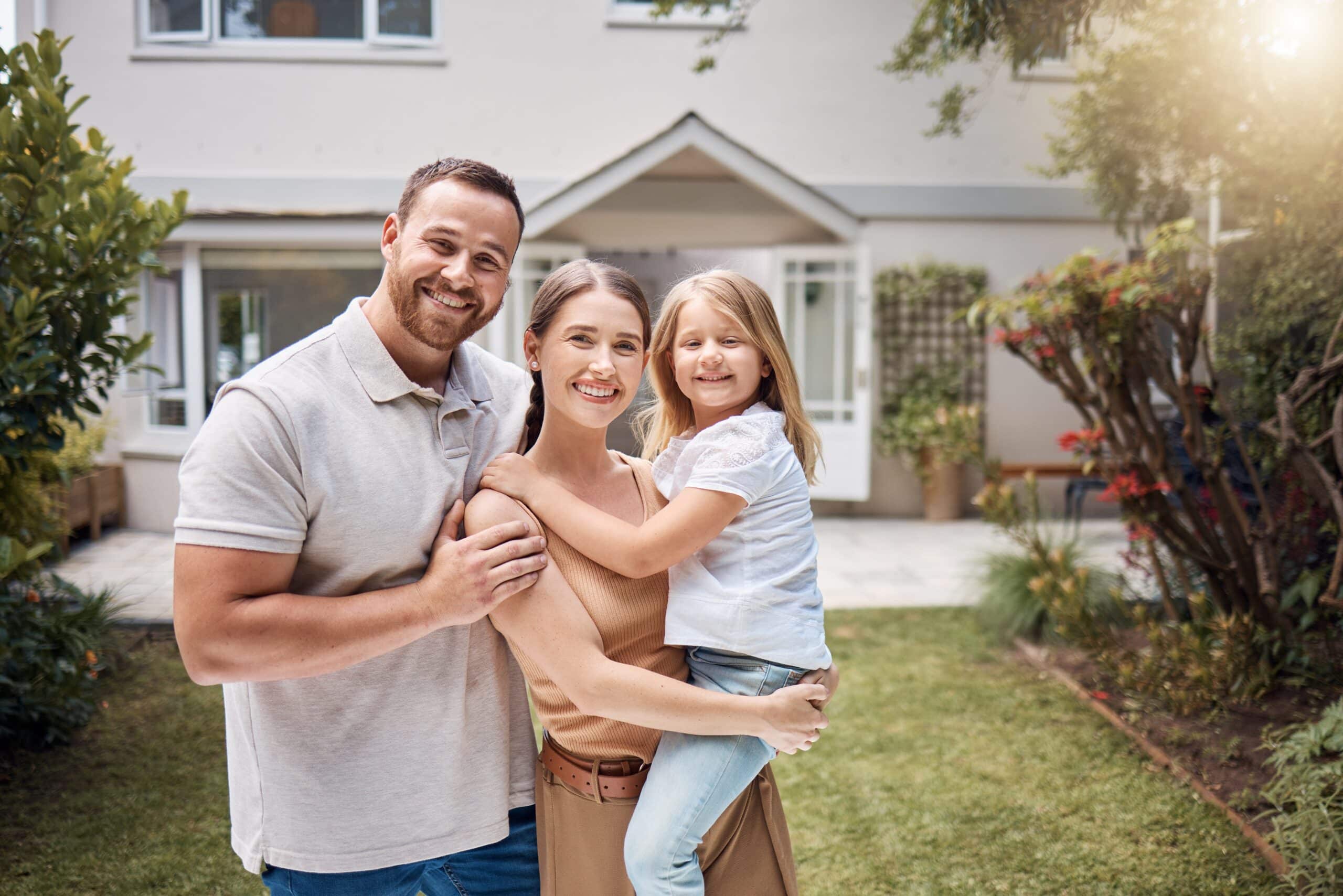 happy family infront of residential home